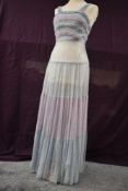 A 1940s lace gown having contrasting lilac and blue bands and blue velvet to top of bodice and