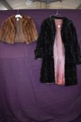 A vintage coney wrap and a mole skin coat.
