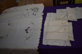 A vintage linen table cloth and napkins with cut work and embroidery.