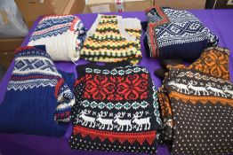 A lovely lot of hand knitted jumpers and knit wear, all having different designs, around 1950s/60s.