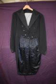 A gents vintage black tailcoat with grey waistcoat, around 1950s.
