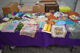An array of vintage scarves and handkerchiefs, some wonderful bright patterns and designs.