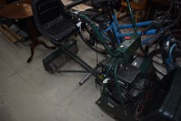 A vintage petrol ride on lawnmower by Atco having Briggs and Stratton engine