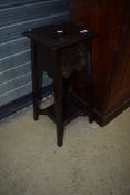 A traditional stained frame low plant stand