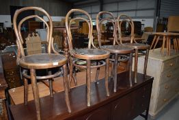 A set of four traditional bentwood chairs