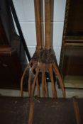 A pair of rustic hay or muck forks