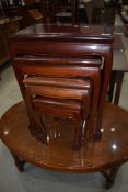 A nest of four oriental hardwood occasional tables