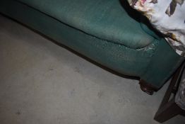 A Victorian Chesterfield settee having later floral loose covers