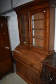 A 19th Century mahogany bureau bookcase having glazed upper section with three adjustable shelves,