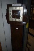 An early 20th Century grandaughter style long cased clock, runs but sometime misses chime