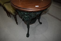 A traditional Britannia style pub table having mahogany top, diameter approx. 65cm