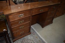 An interesting Victorian mahogany in the Aesthetic style of narrow proportions, central drawer