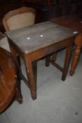 A vintage wooden school desk
