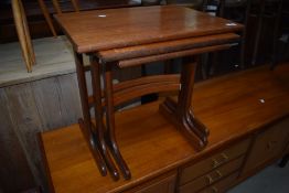 A vintage G plan nest of three stylised table