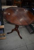 A 19th Century mahogany occasional table having dish top, on burr elm triple splay base