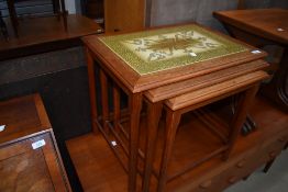 A vintage teak and tile top nest of three tables, stamped Denmark