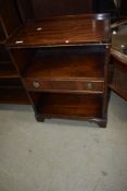 A reproduction regency style bedside table with single drawer to centre shelf