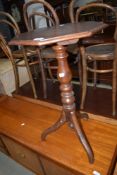 A 19th century mahogany occasional tripod table having octagonal top on turned column and triple
