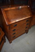 A reproduction yew wood bureau, by Reprodux