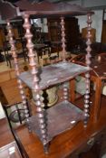 A 19th Century stained frame whatnot having interesting bobbin frame