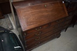 A 19th Century mahogany bureau of large proportions with fitted interior, drop flap and two over