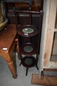 A 19th Century mahogany three tier cake stand having turned frame
