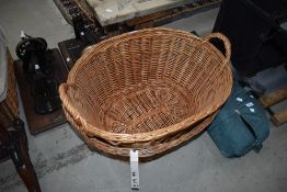 Two wicker laundry baskets