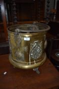 A brass coal bucket and copper pans etc
