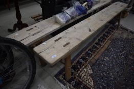 A pair of traditional stripped pine forms, length each approx. 199cm