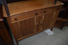 A vintage bleached mahogany sideboard having double frieze drawer and ribbed doors, width approx.