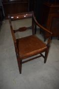 A 19th Century rail back dining chair in the Regency style