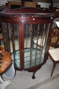 An early 20th Century mahogany bow fronted display cabinet