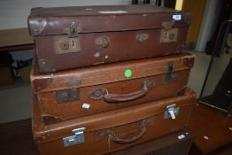 Three vintage suitcases