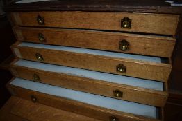 A vintage oak plan chest, containing large portfolio of printed and mounted works from Casells 1960s