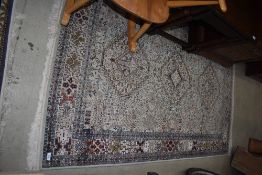 A traditional fireside rug, approx. 190 x 122cm