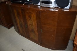 An early to mid 20th Century sapele sideboard having stepped design, with central double cupboard