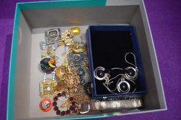 A selection of costume jewellery including yellow metal brooches and a matching set of ear rings and