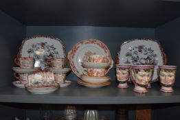 An assortment of oriental and oriental styled cups and saucers and plates. Also included are four