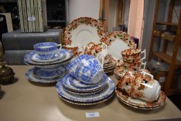 A selection of vintage blue and white tuppack china and a similar amount of wellington china in rust
