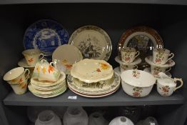 A mixed lot of ceramics including cheerful art deco tea cups and saucers and plates with orange,