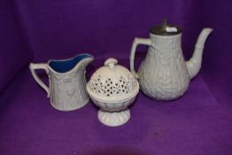 A trio of cream ceramics, a lidded tea pot having bamboo effect, lidded Leeds ware Tazza and a jug.