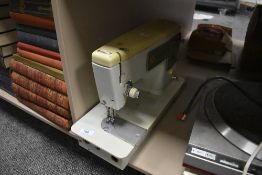 A vintage Singer sewing machine, model number 449.