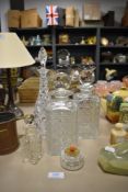 A selection of clear cut glass wares including decanters and scent bottle