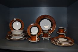 A selection of hand decorated Roccoco dinner having walnut effect pattern included are bowls, coffee