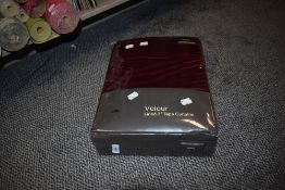A set on unused wine coloured Velour curtains, new in packaging, 168cm by 183cm.