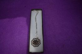 A modern three strand style white metal necklace by Silpada and a brooch