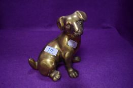 A heavy brass terrier figurine.