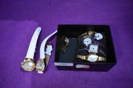 Eight assorted fashion wrist watches including two baring inscription 'Bichon Frises leave pawprints