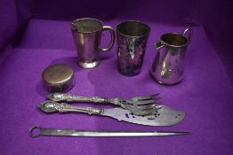 A selection of silver plated ware including napkin rings jug pinch bowl fish servers etc