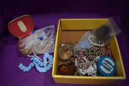 A selection of costume jewellery including vintage beads bangles and some loose and a coin
